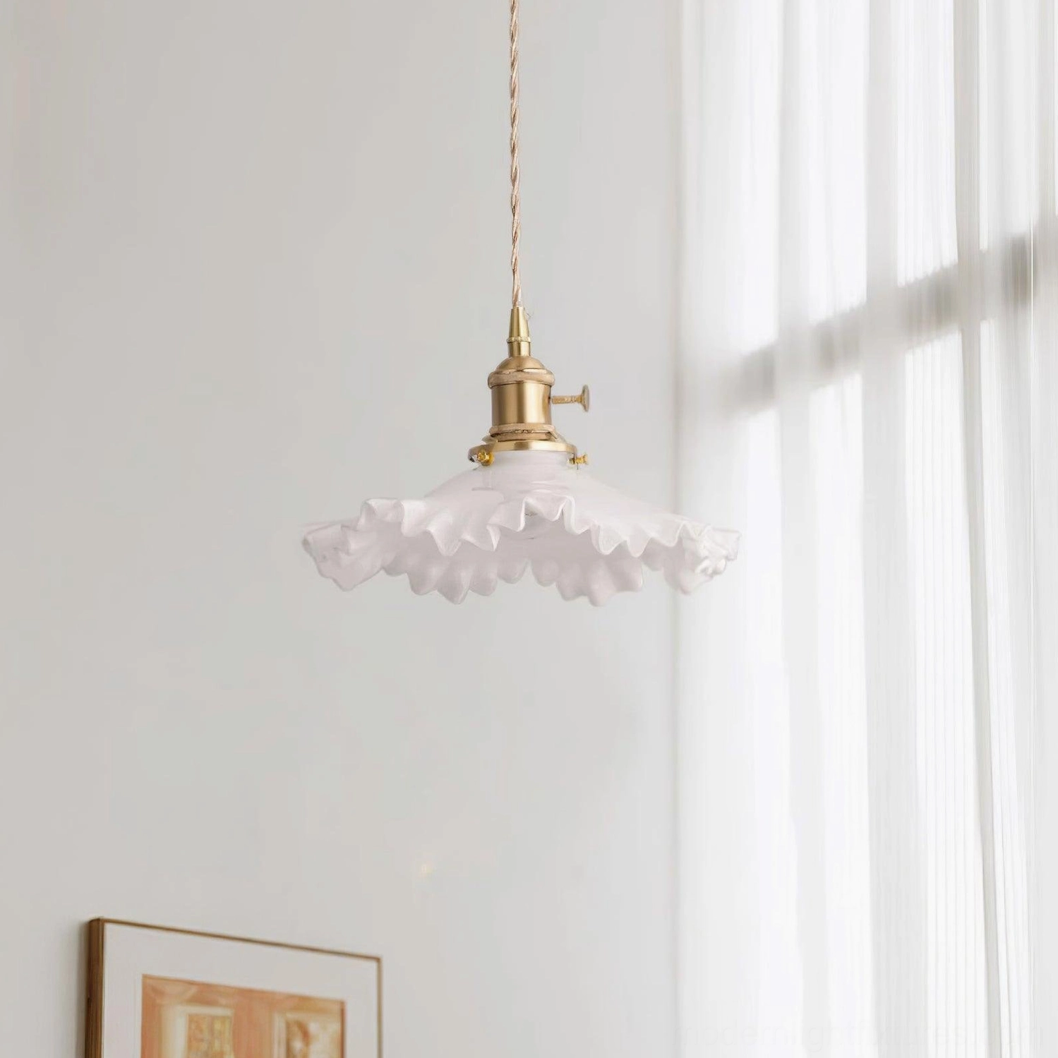 Ruffled glass pendant light in contemporary home setting, showing warm ambient lighting quality