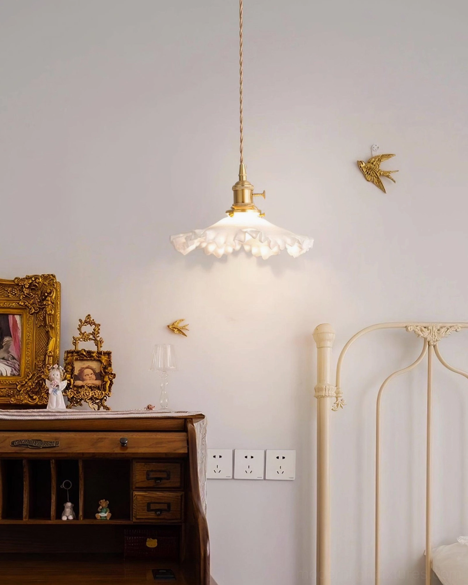 Ruffled glass pendant light fixture showing light dispersal and warm glow through textured shade