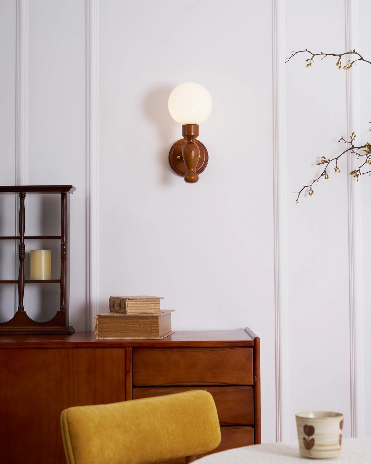 Rustic wood sconce with hand-crafted fabric shade, traditional artisanal