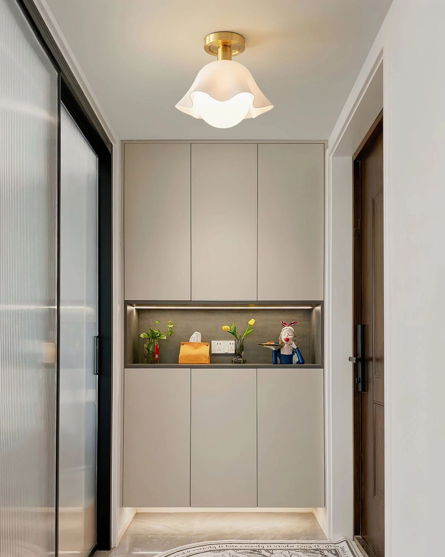 Rustin semi-flush fixture mounted in residential entryway with cabinetry and glass door - light luxury home design
