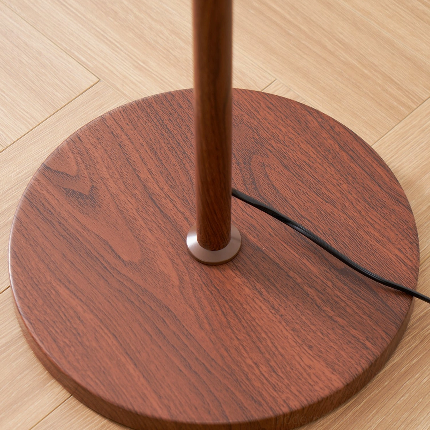 Rustina floor lamp industrial loft setting showing metal components softening harsh concrete and exposed brick
