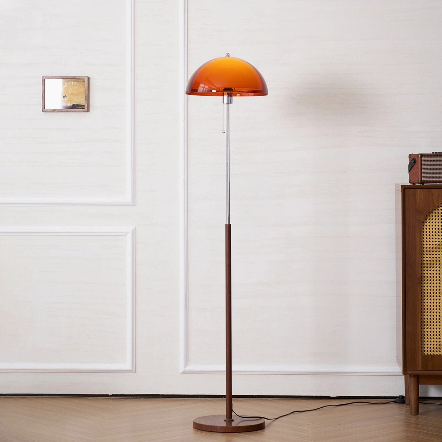 Rustina floor lamp beside sofa seating area creating cozy lounging environment with warm amber light