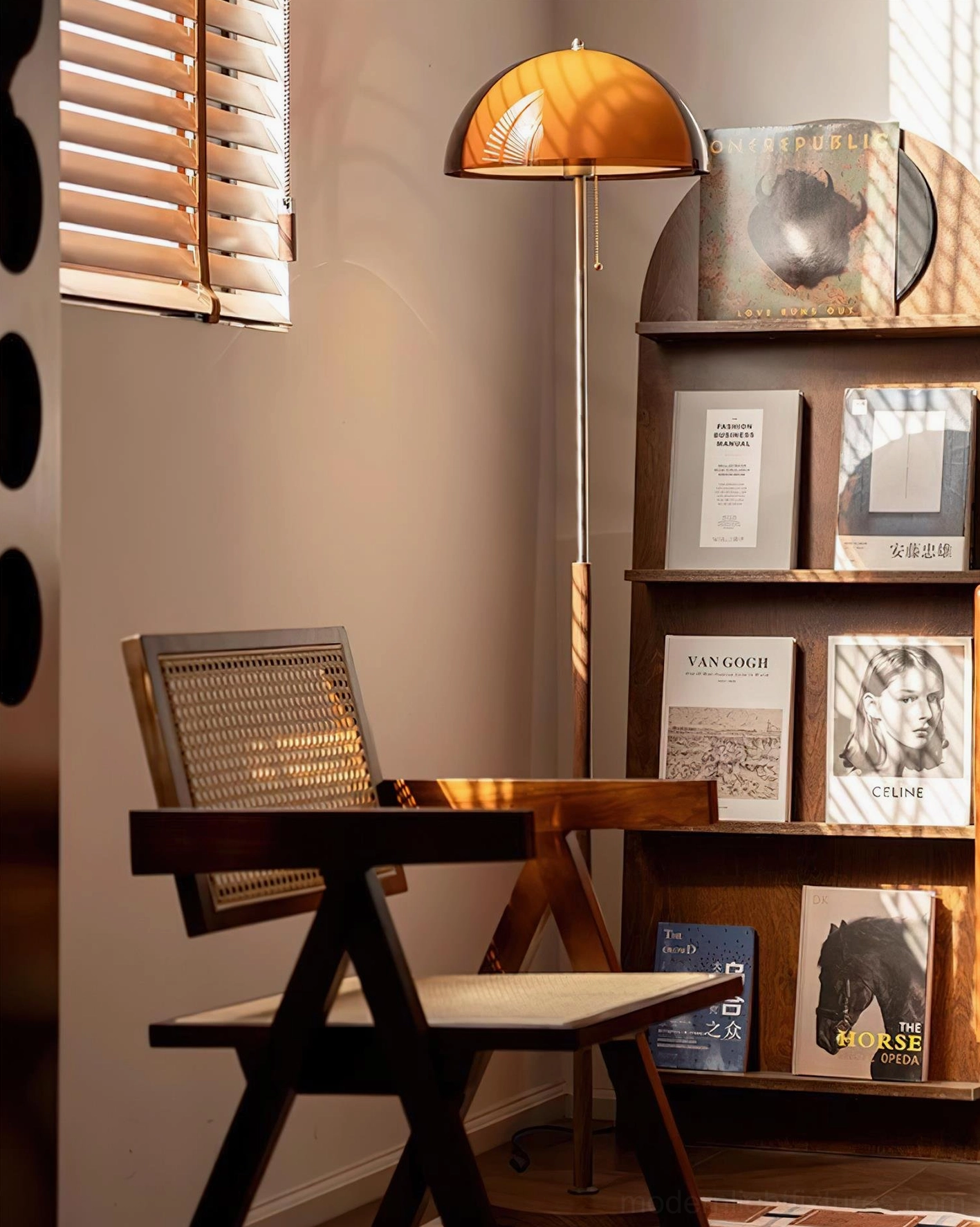 Rustina dome floor lamp beside wooden bookshelf in study corner, oblique angle highlighting metal pole and semi-transparent amber shade