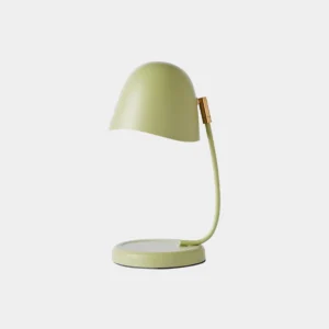 Modern sage green candle warmer table lamp with adjustable brass-finished arm on white background