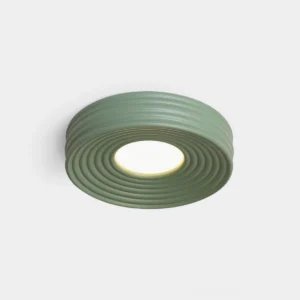 Sage green ribbed flush mount ceiling light with concentric circular texture pattern, front studio view