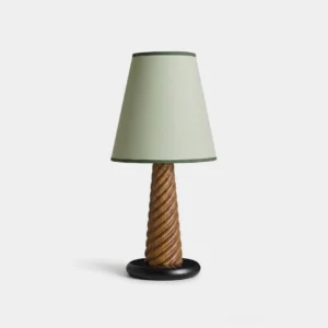 Sage green fabric shade table lamp with barley-twist wooden column and black base, frontal studio view