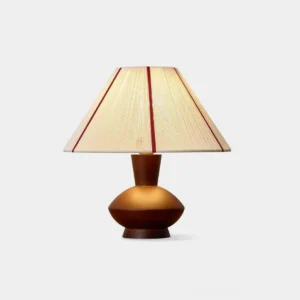 Sandia hand-woven mid-century modern table lamp with beige pleated fabric shade and red stripe, solid walnut turned wooden base, front studio view