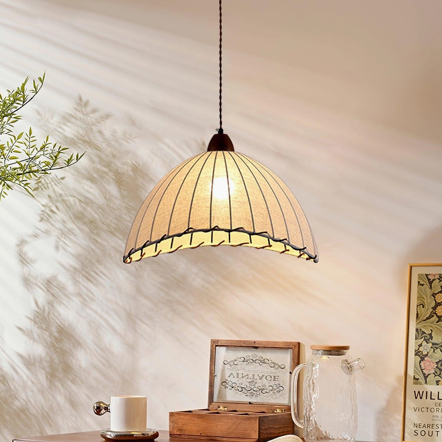 Sanna pendant light hanging at three-quarter angle creating ribbed texture shadow on wall