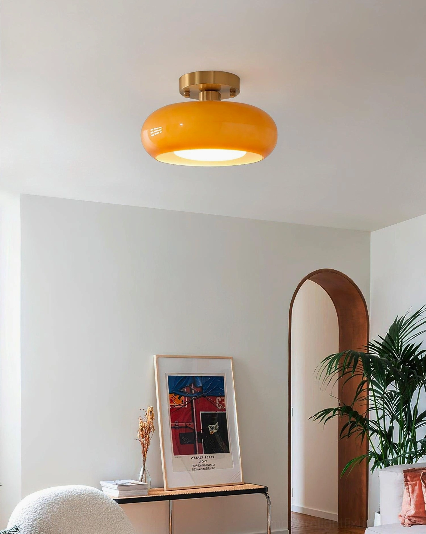 Sanna glass dome ceiling light in living room with vintage decor and warm brass hardware detail