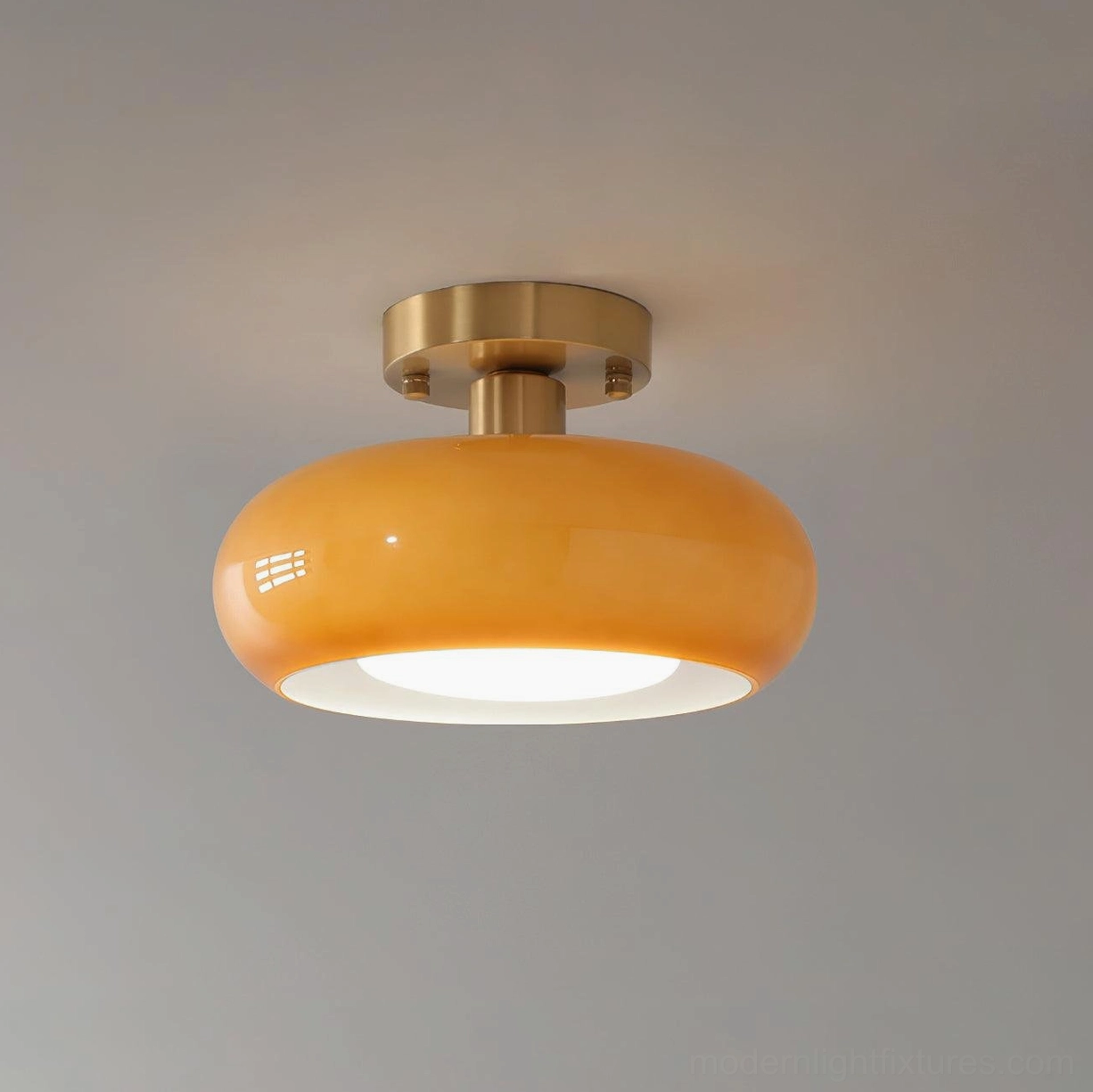 Sanna glass ceiling light detail showing optical-grade smooth dome and light diffusion