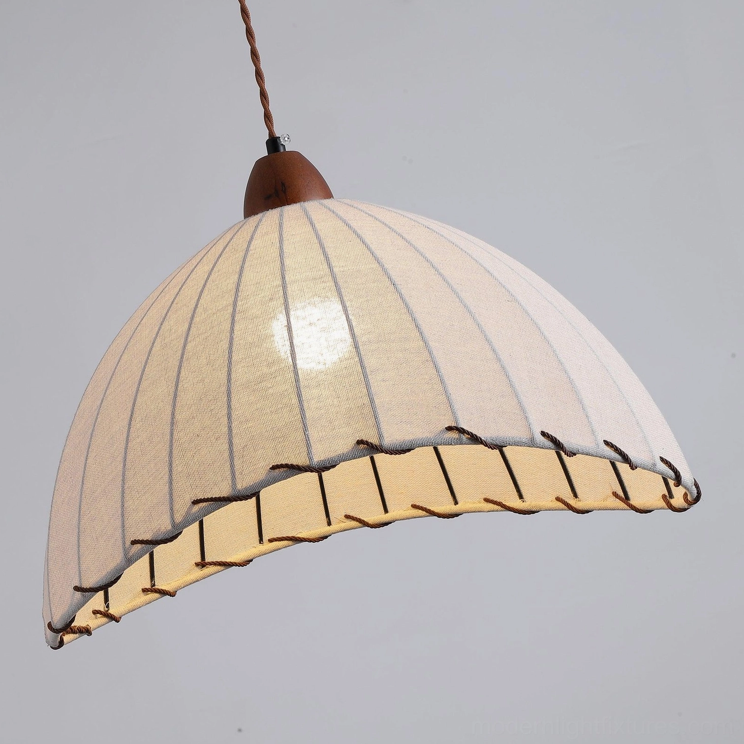 Sanna ribbed fabric pendant light creating soft ambient glow in dining space