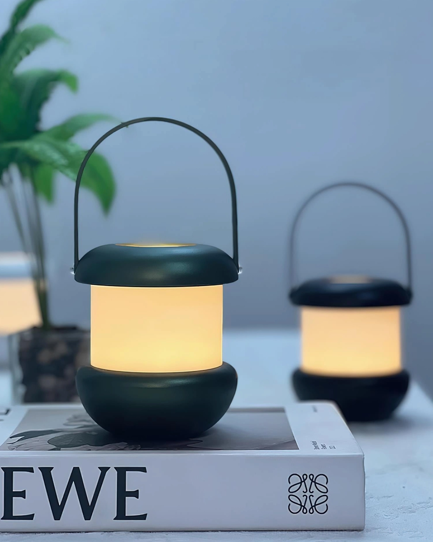 Sarina LED rechargeable lantern lamp in black and green creating cozy ambient atmosphere for indoor spaces