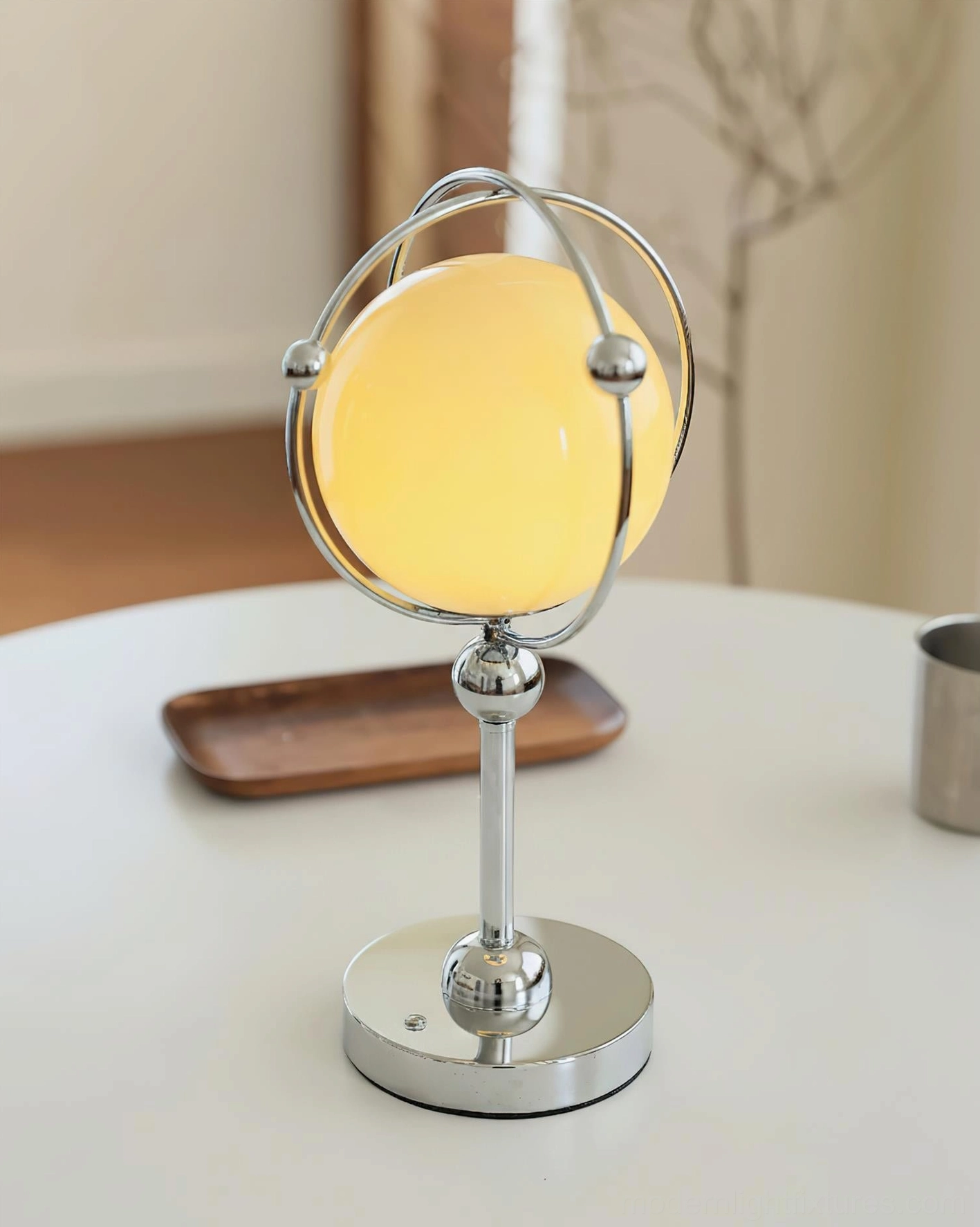 Saturn Hoop Table Lamp modern orbital design - chrome metal rings with frosted glass sphere detail