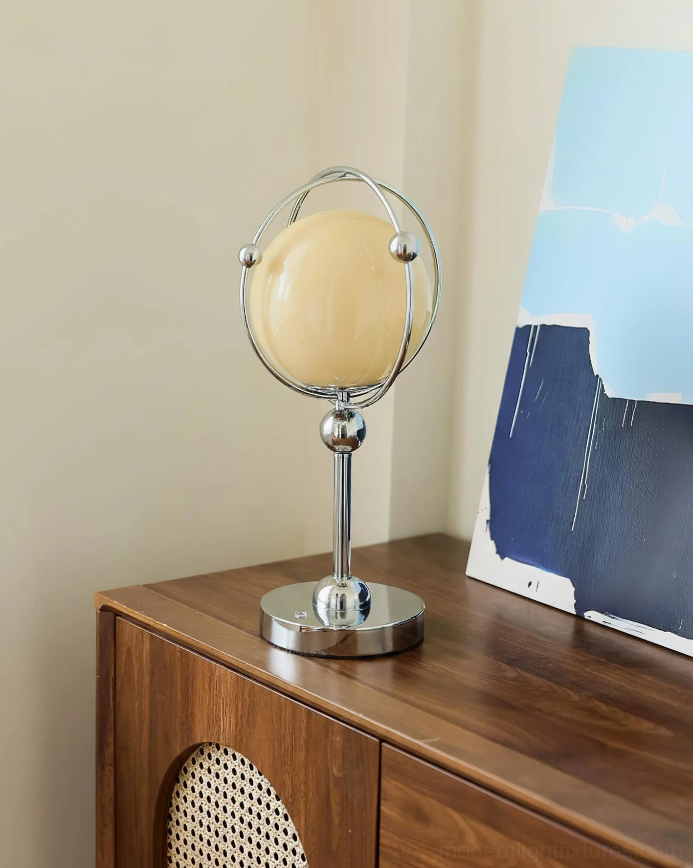 Sculptural Saturn Hoop Table Lamp on wooden side table with abstract art - minimalist room decor