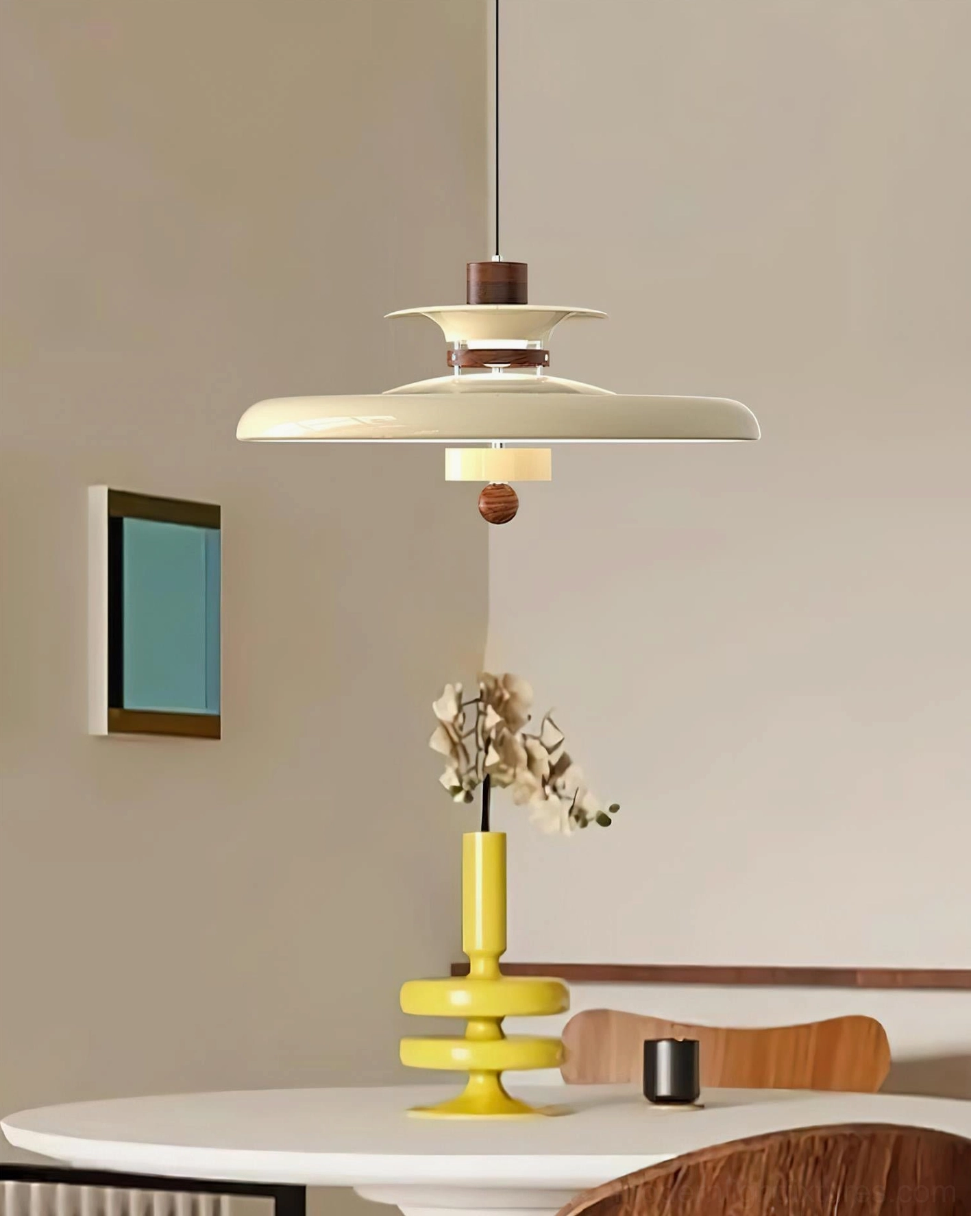 Beige Saturn Pop layered disc pendant lamp with cream white body and brown accents in modern dining space