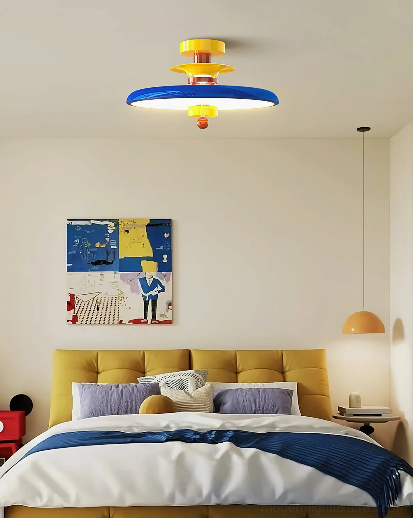 Saturn Pop ceiling light installed in contemporary bedroom with yellow tufted headboard and blue accent