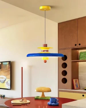 Saturn Pop pendant light installed in residential dining area with blue, yellow and brown color palette