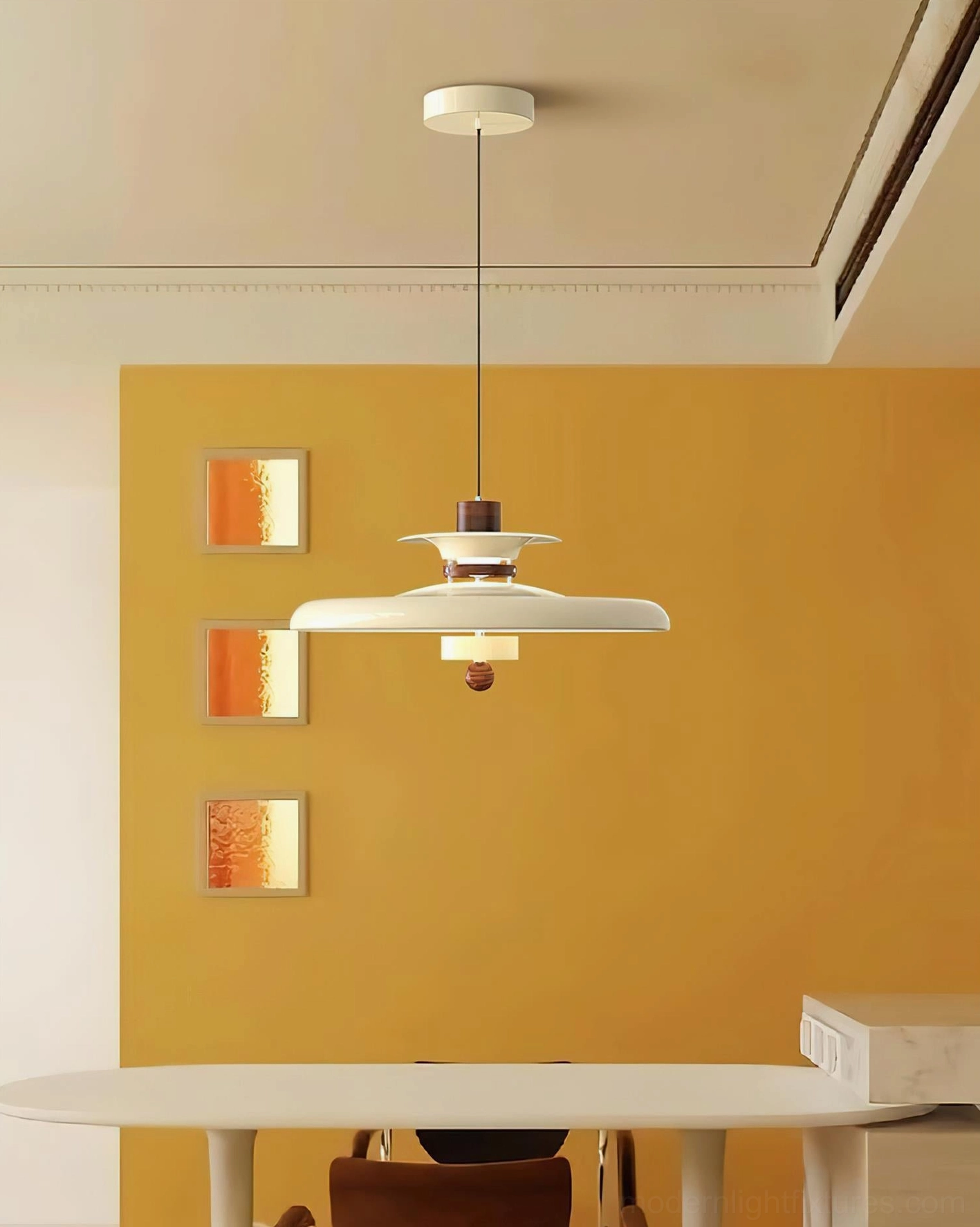 Saturn Pop off-white and neutral brown tone pendant lamp above dining room with yellow accent wall