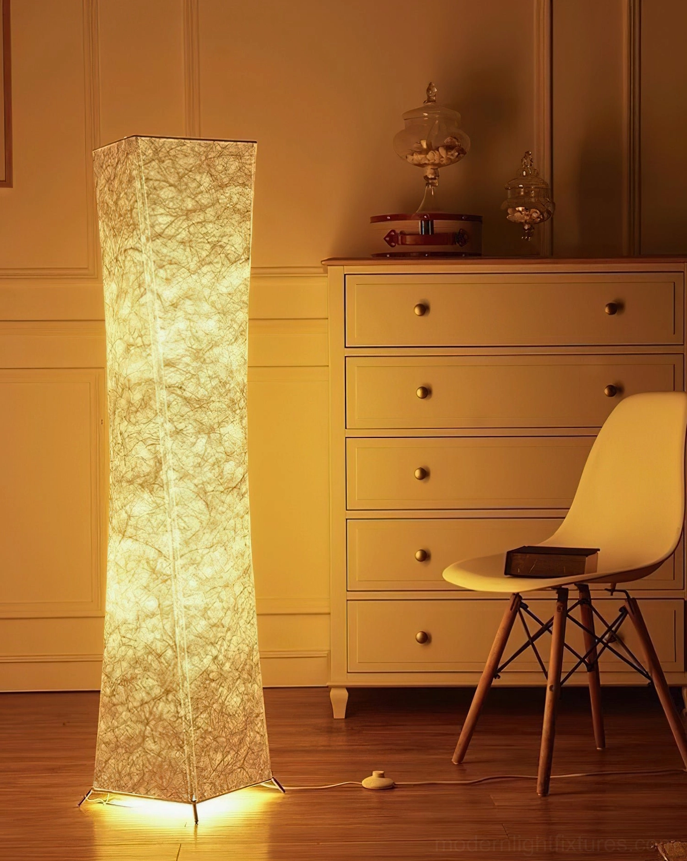 Saura modern floor lamp with textured white shade in bedroom vanity corner with mid-century modern decor aesthetic
