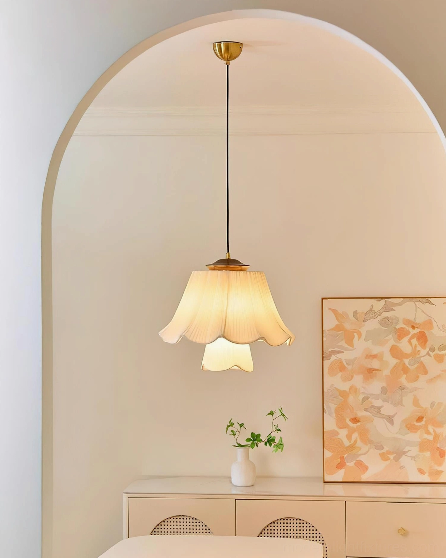 Savena pendant lamp with cream pleated ruffled shade creating warm glow in cozy living room with arched doorway and cottage aesthetic