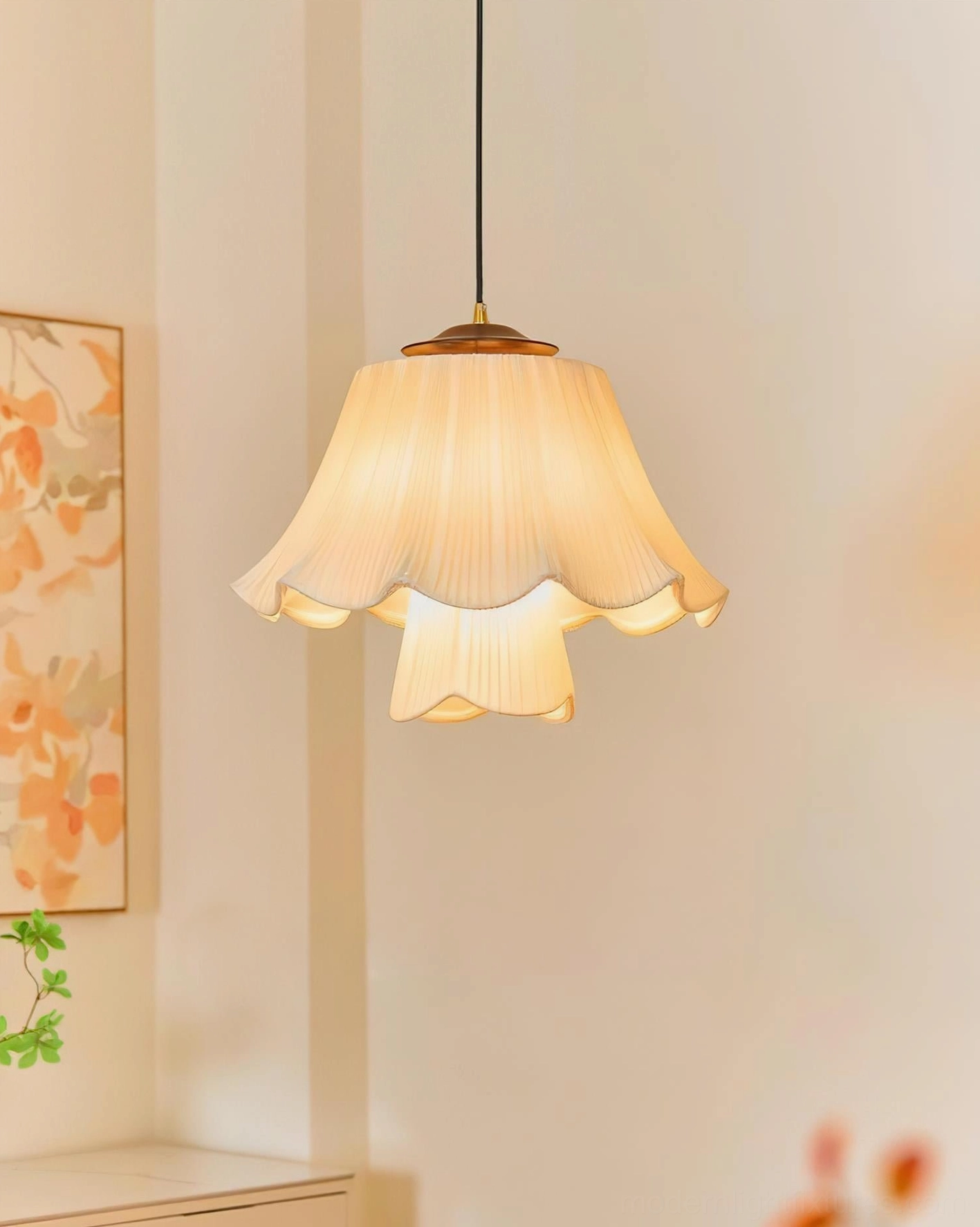 Savena single-tier pleated pendant lamp with cream ruffled fabric shade, left side profile view in cozy cottage interior