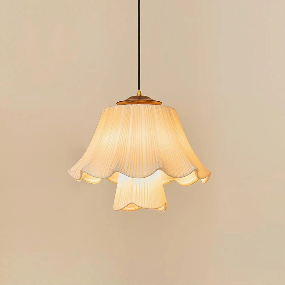 Savena pleated pendant lamp with scalloped ruffled fabric shade and brass hardware, right side eye-level view