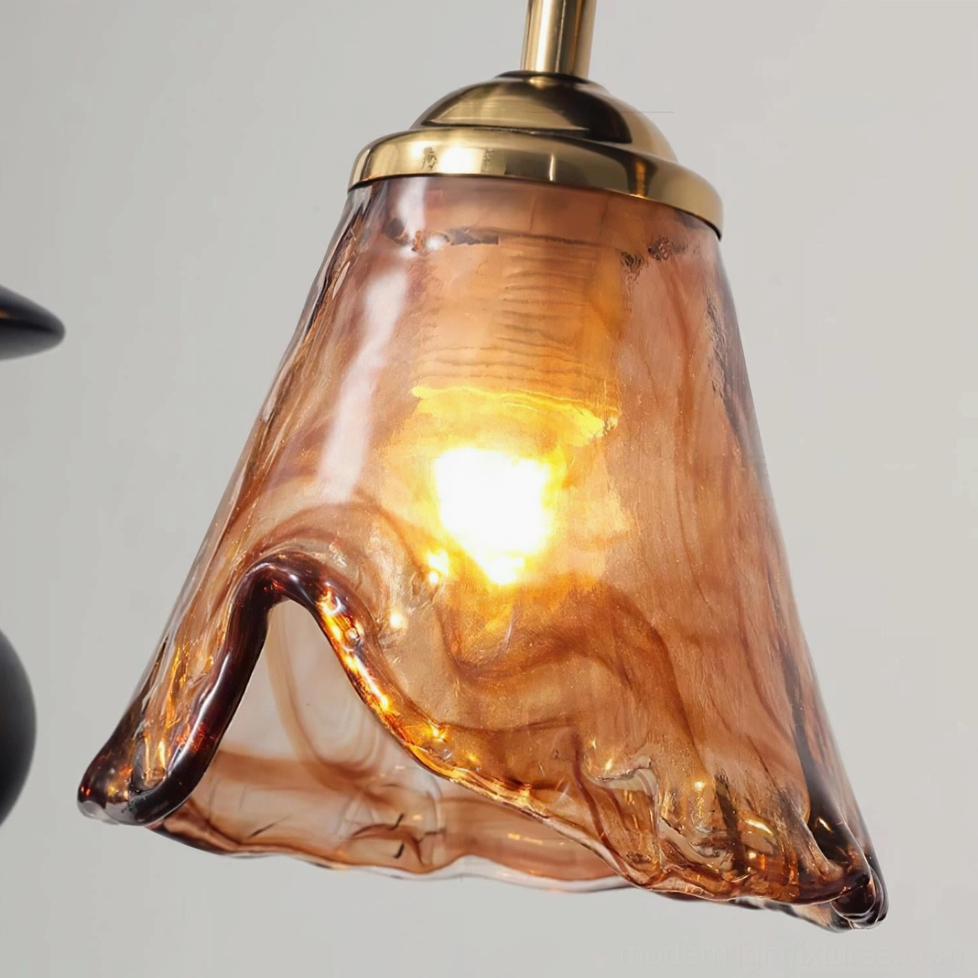 Savoy amber rippled glass lamp shade close-up bell shape illuminated interior brass fixture cap detail