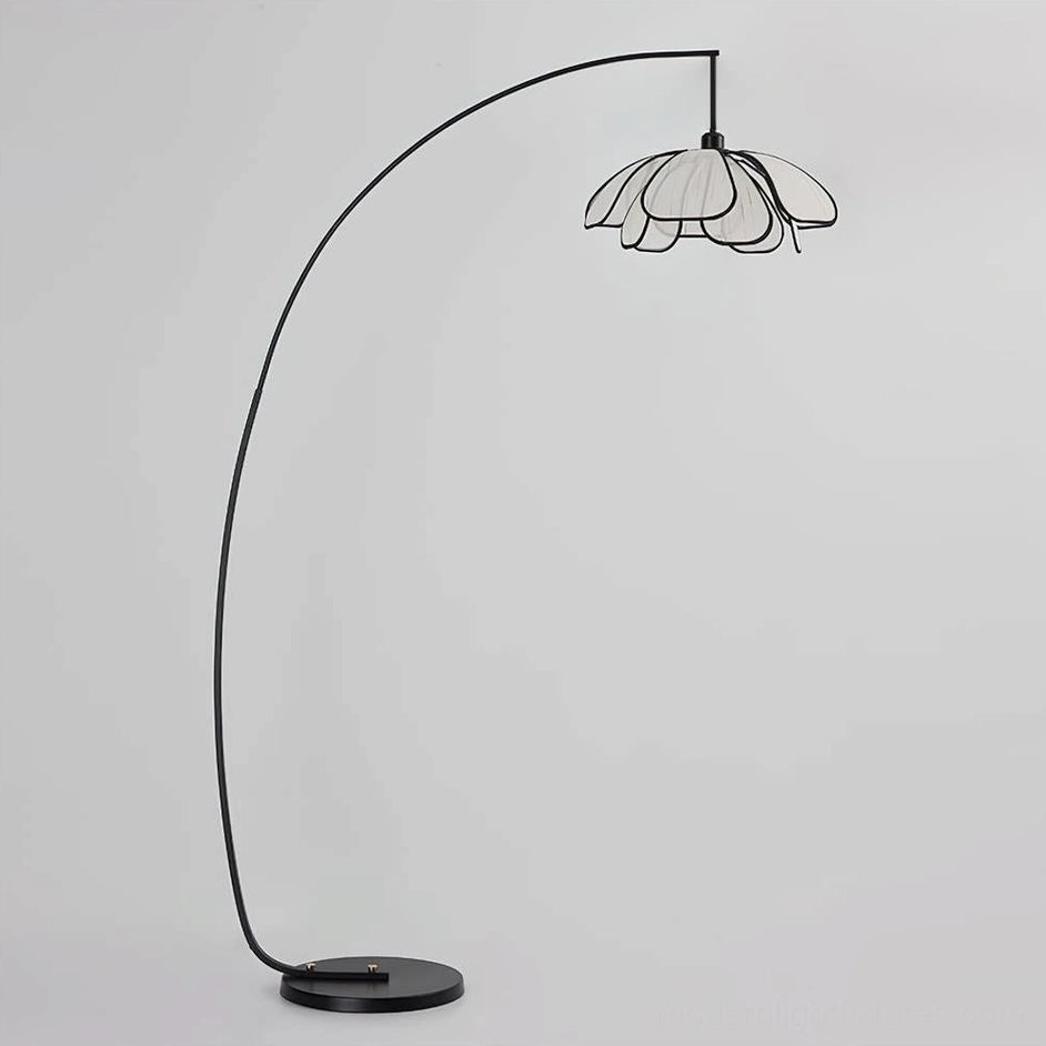 Savoy arc floor lamp front profile view with curved black metal pole and circular base on neutral gray background
