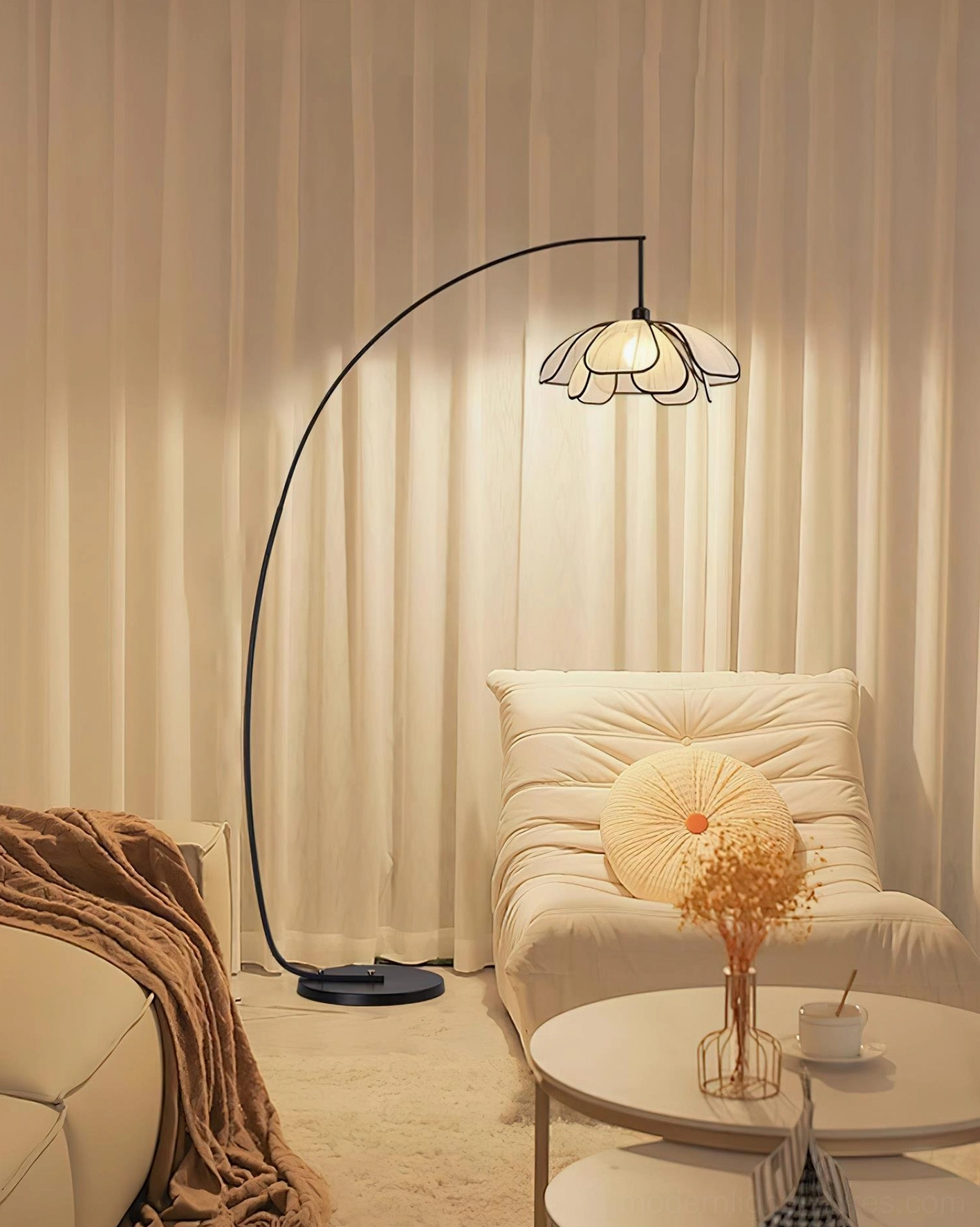 Savoy arc floor lamp in Nordic living room setting with sofa and coffee table, warm ambient lighting and cozy minimalist decor
