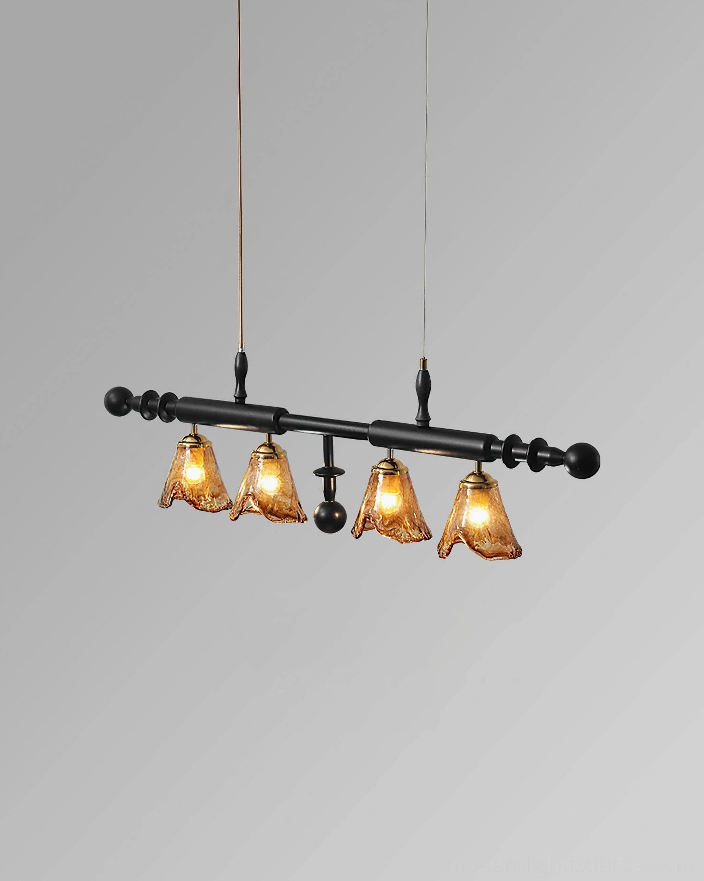 Savoy 4-light linear pendant chandelier with dual suspension cords and decorative black metal frame gray studio background