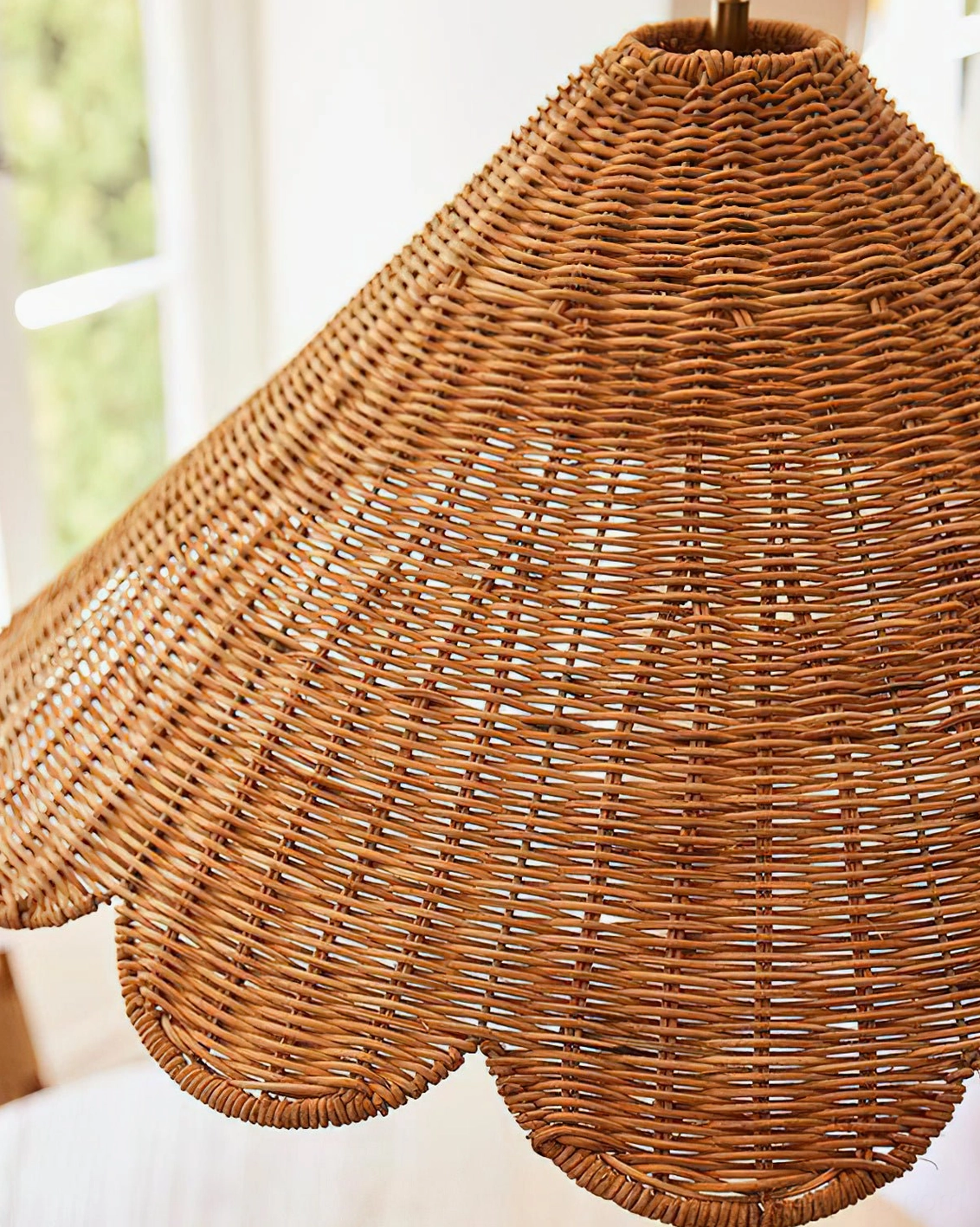 Scallop rattan pendant light with metal base showing complete fixture construction and design