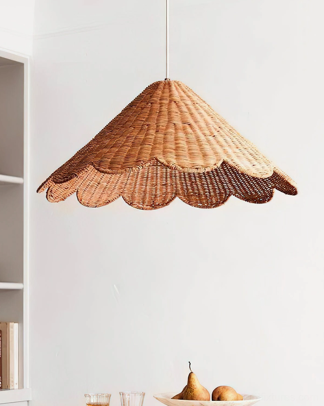 Woven rattan scallop pendant light three-quarter side view showing organic texture and sculptural form