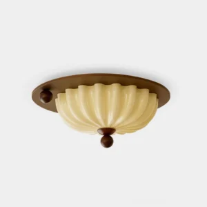 Scallop shell ceiling light fixture with ribbed frosted glass shade and walnut metal hardware, studio front view