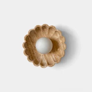 Scallop shell wall sconce with travertine and frosted glass - front view on white background