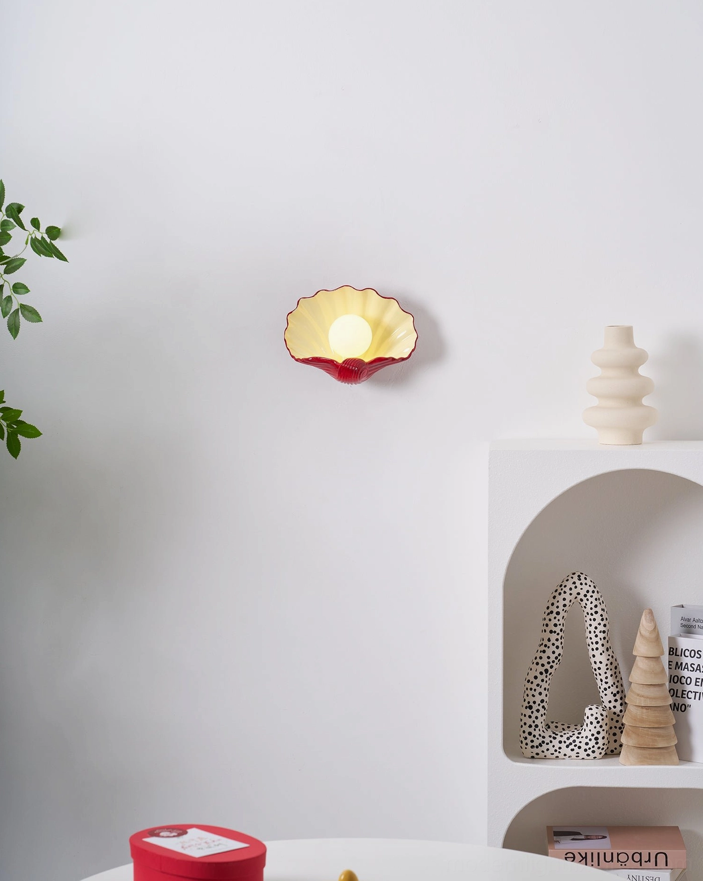 Scallop shell wall lamp with warm glow, cream and burgundy ceramic, intimate bedroom or bathroom lighting