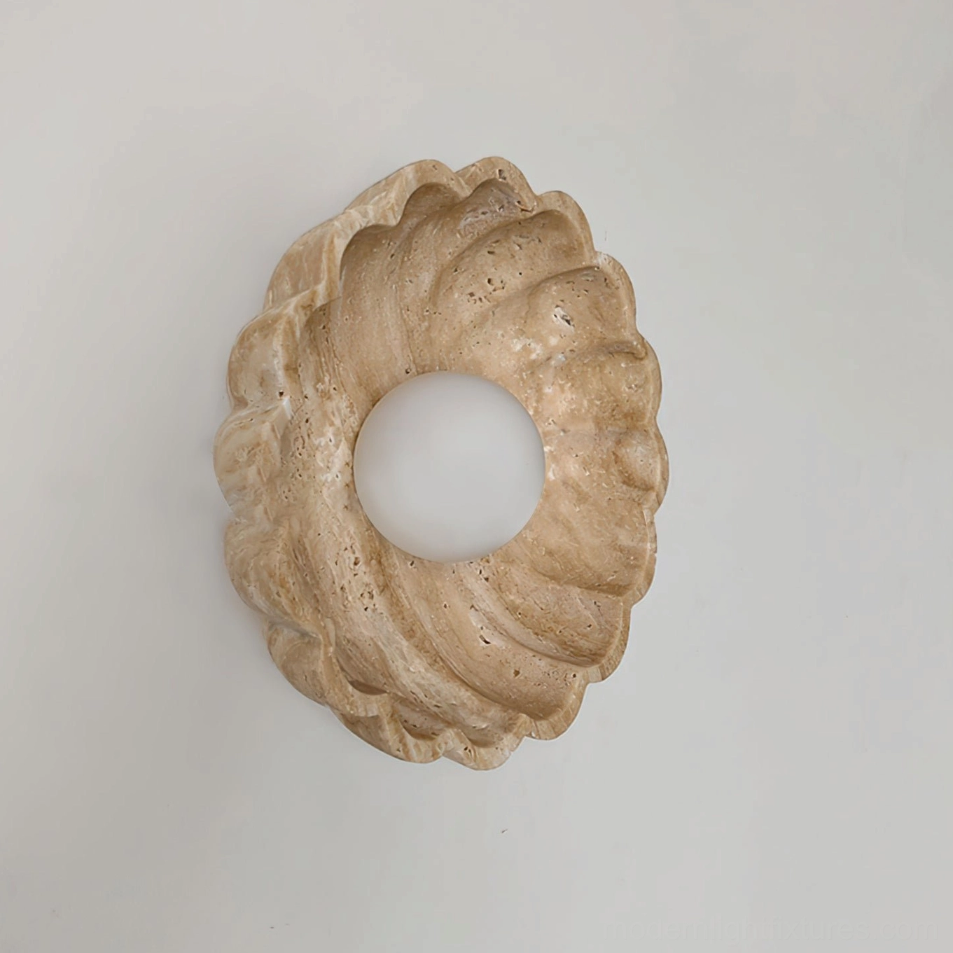 Scallop wall sconce three-quarter side view showing curved travertine shell profile