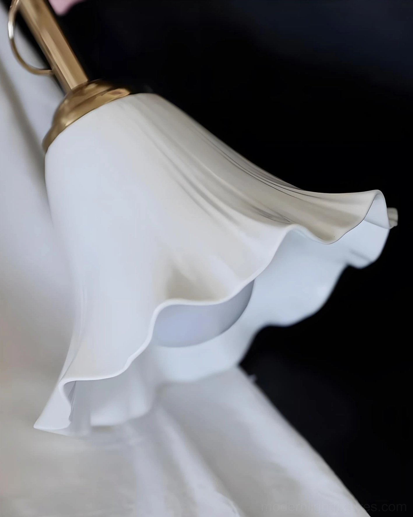 Petalisse rose pendant light showcasing scalloped ceramic edge and delicate brass vine detailing