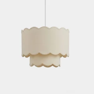 Scalloped cream fabric pendant light with wavy trim on white background, front close-up view of double-layer drum shade design