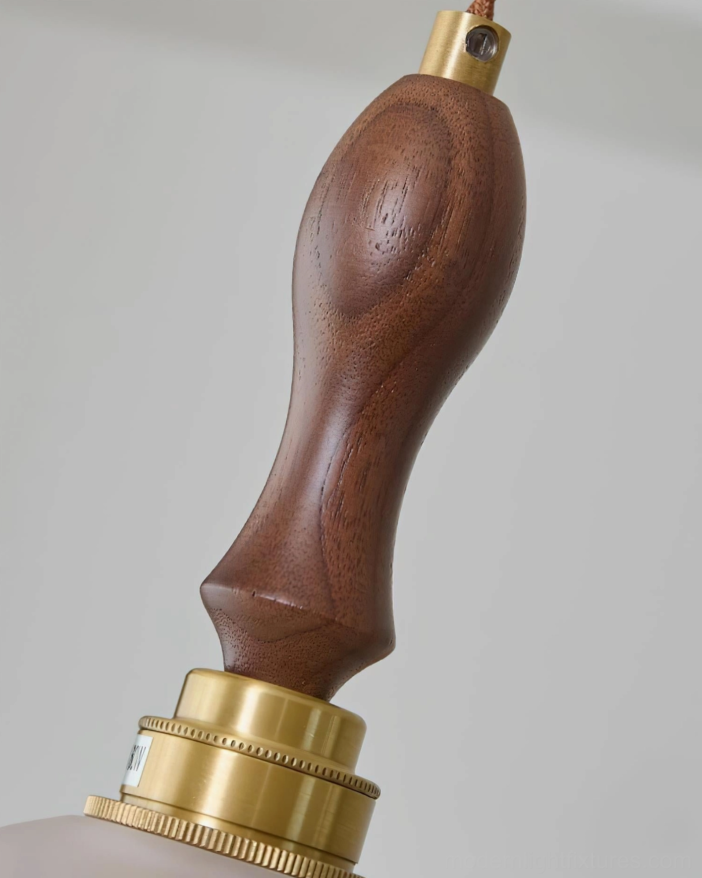Brielle pendant light showing scalloped glass edge and walnut wood fixture components