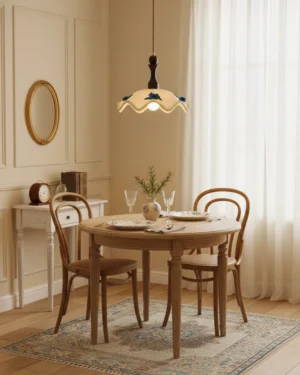 Scalloped pendant light hanging in warm vintage dining room with wooden furniture and neutral decor, creating ambient warm light