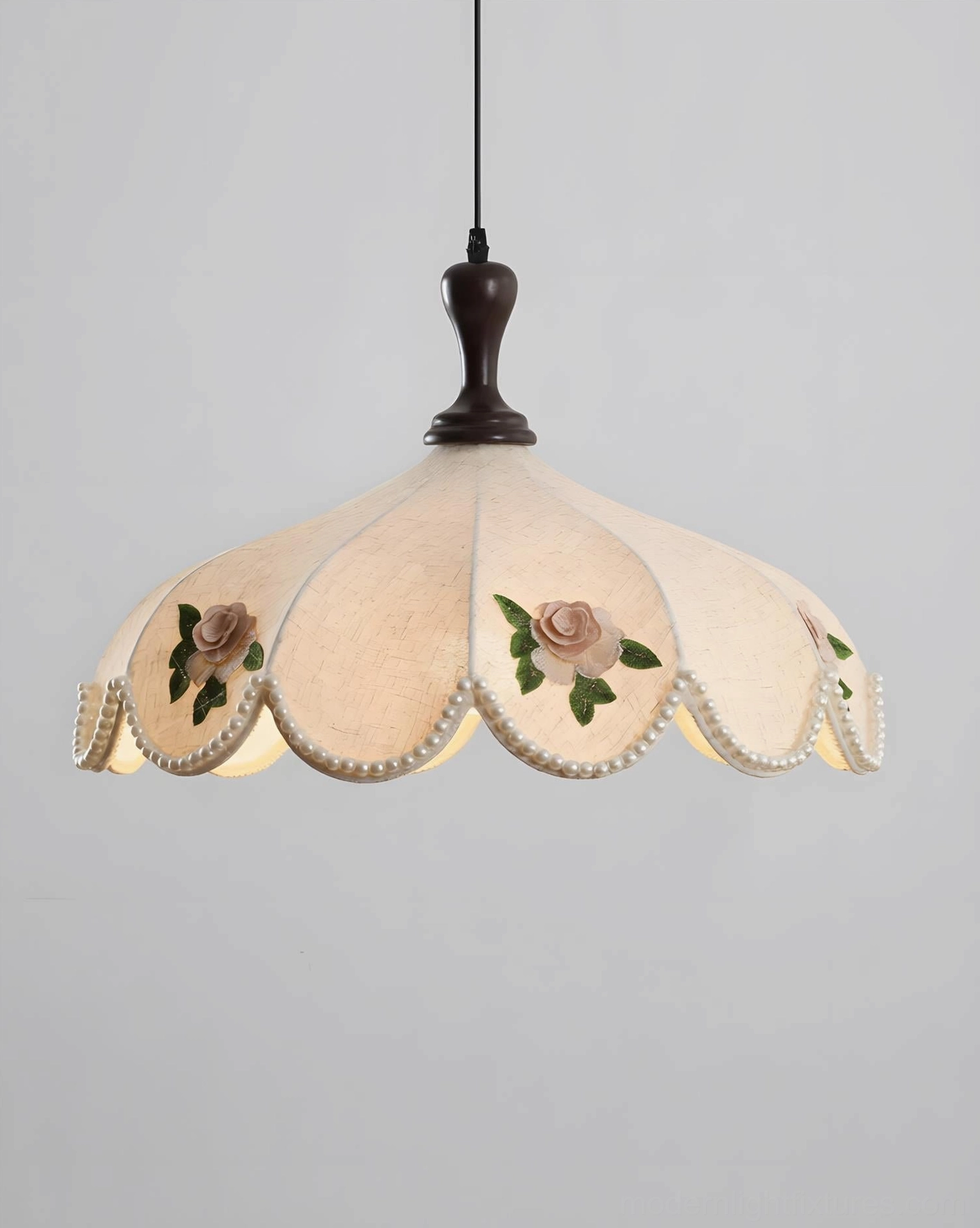 Beaded scalloped edge pendant light with rose embroidery and dark wood fixture detail - studio product view