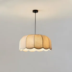 Modern scalloped pendant light with matte black hanging hardware and mounting rod, neutral fabric shade ceiling fixture