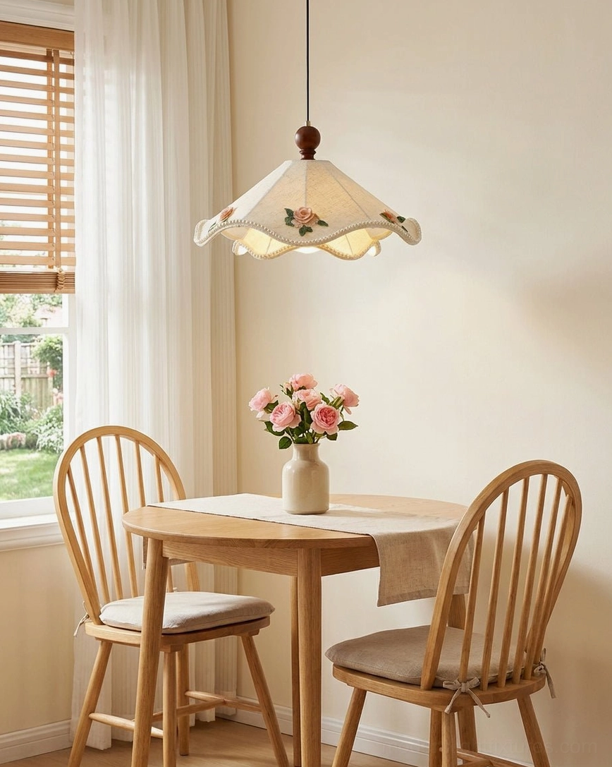 Scalloped fabric pendant light overhead view in compact apartment dining area with minimalist farmhouse furniture