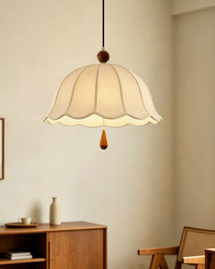 Scalloped pendant light installation detail showing adjustable cord mechanism and solid wood finial craftsmanship