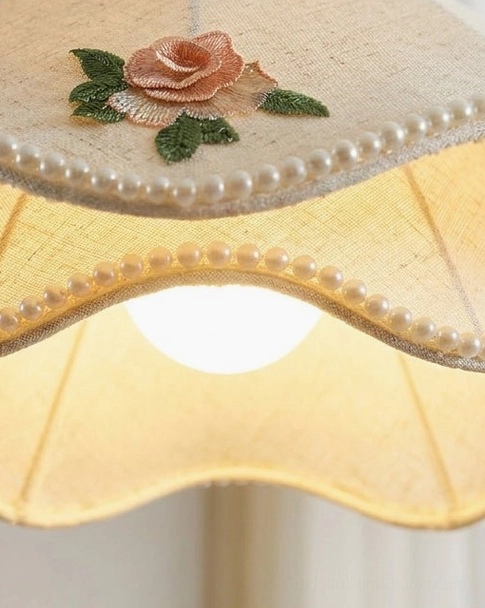Scalloped pendant light with embroidered rose appliqué and turned wood finial architectural detail