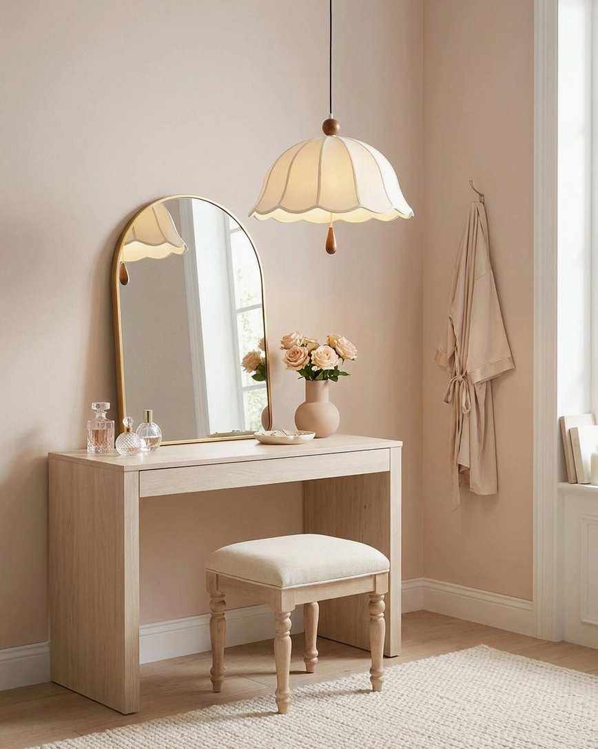 Elegant scalloped pendant light illuminating minimalist vanity makeup station with neutral sophisticated interior design