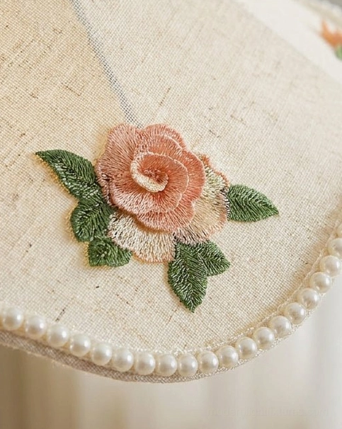 Scalloped fabric pendant light hanging in warm-toned interior with vintage decor and natural materials