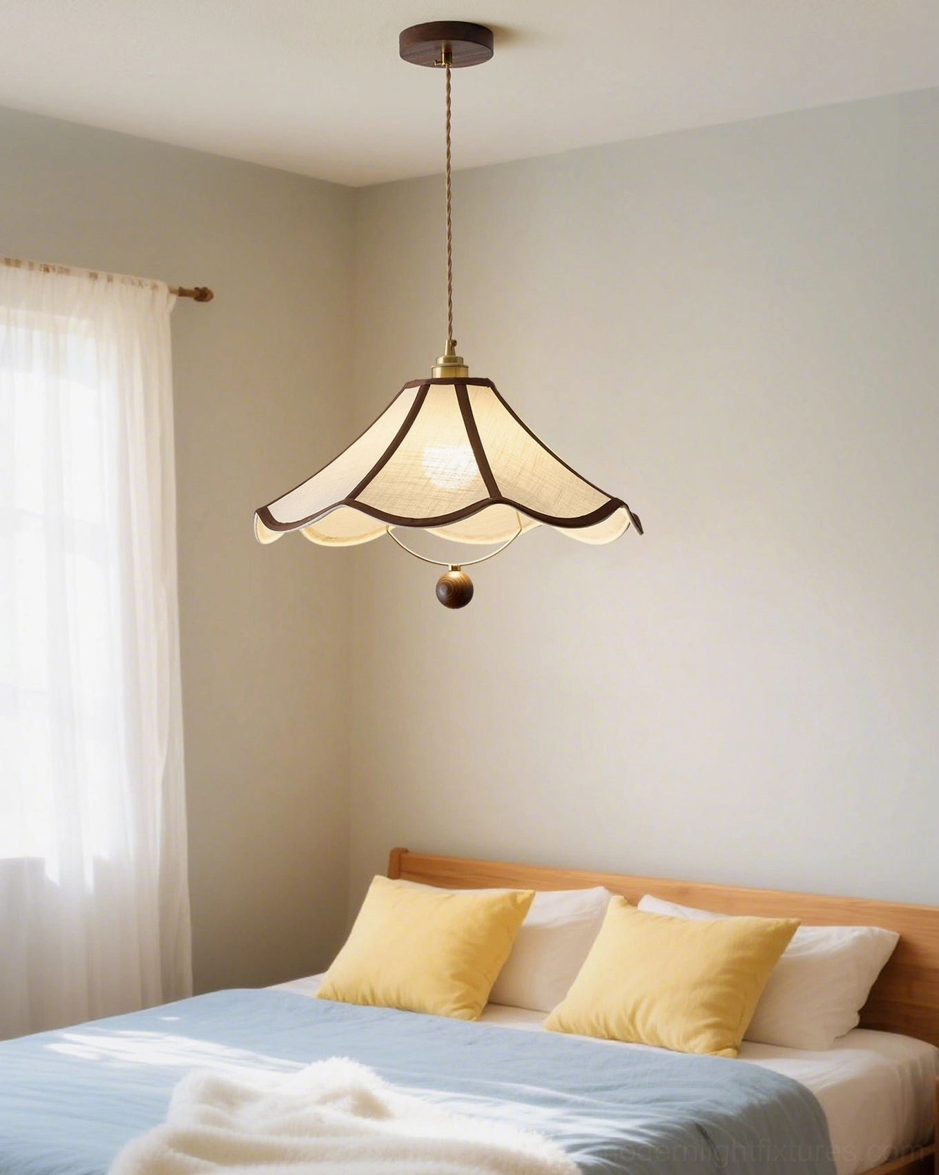 Scalloped fabric pendant light with wooden hanging sphere detail and brass accents