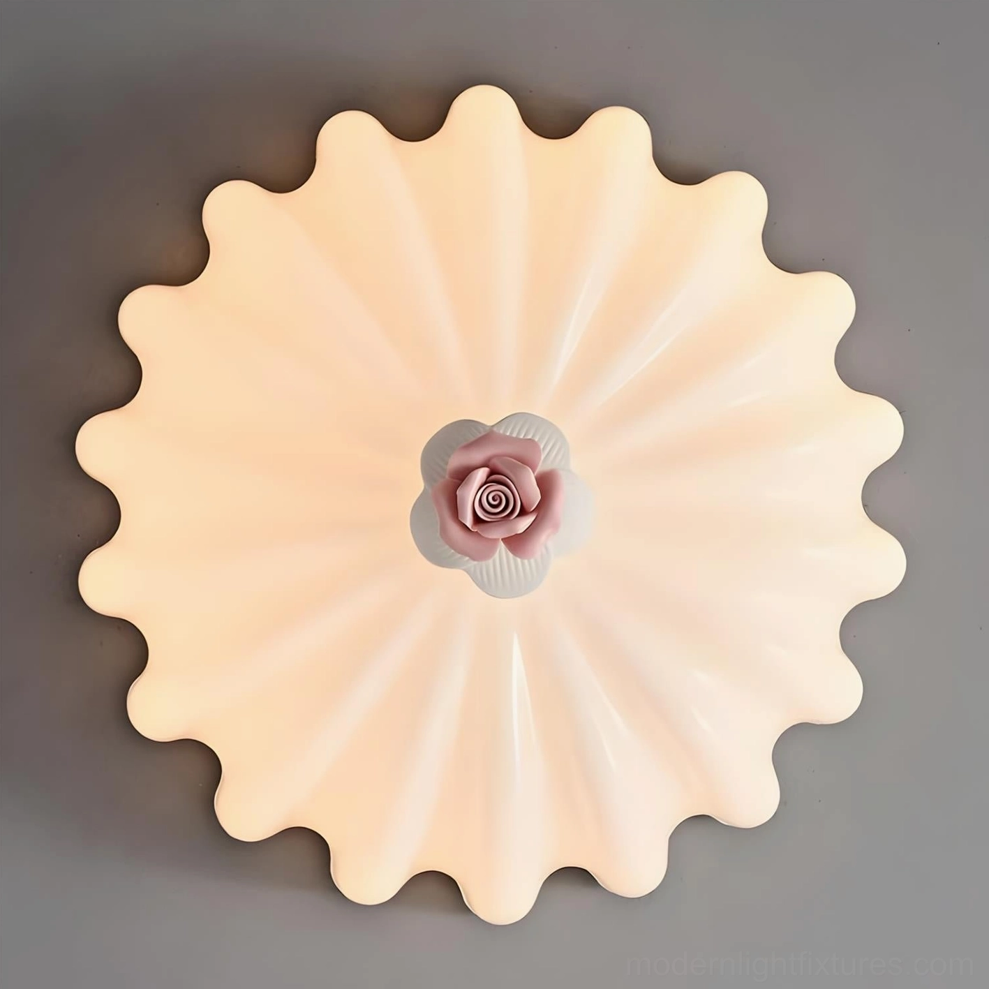 Belle Coquille ruffled scalloped edge ceiling lamp with central pink rose accent, cream-colored frosted glass finish close-up