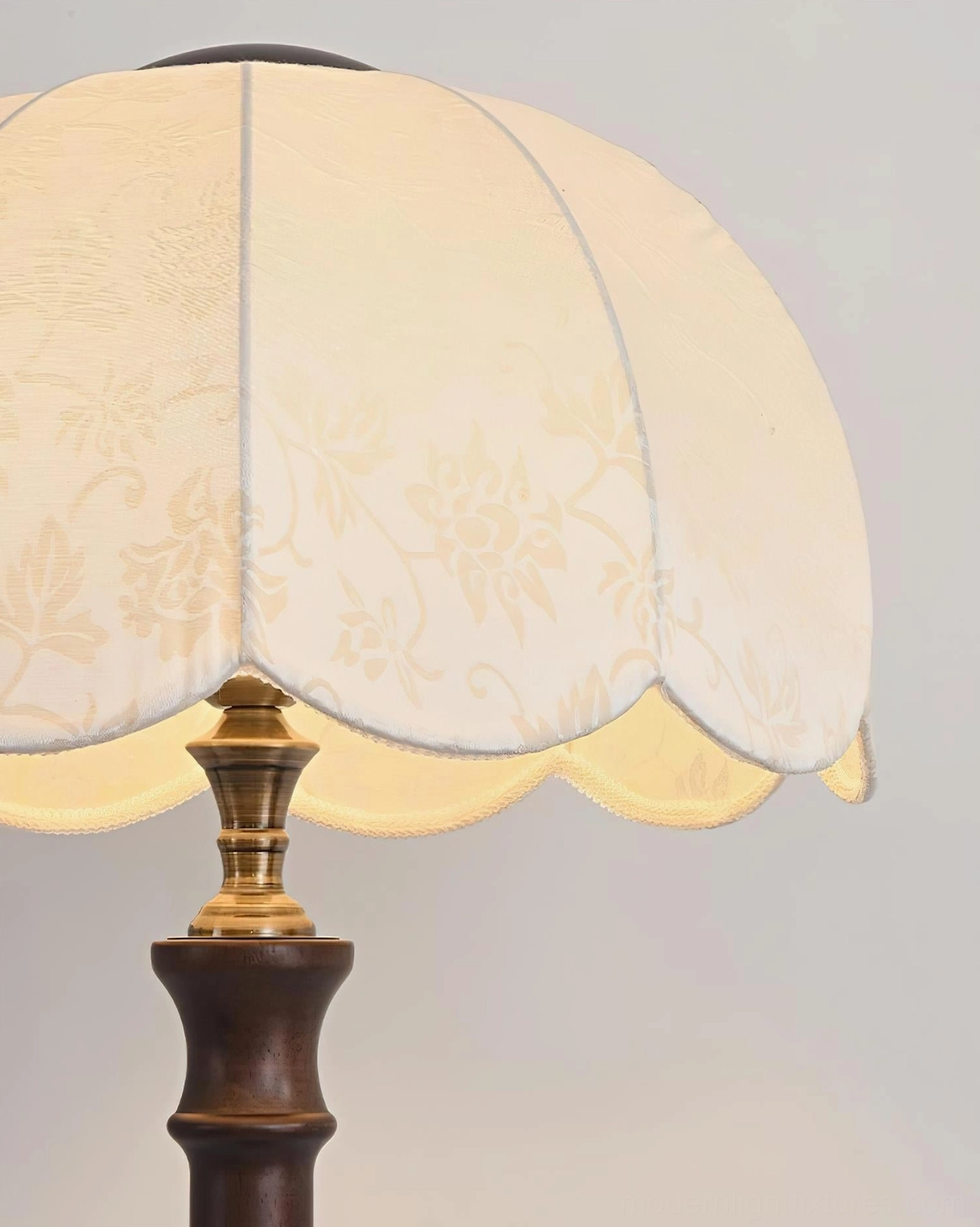 Scalloped vintage floor lamp as accent lighting piece in styled interior design composition